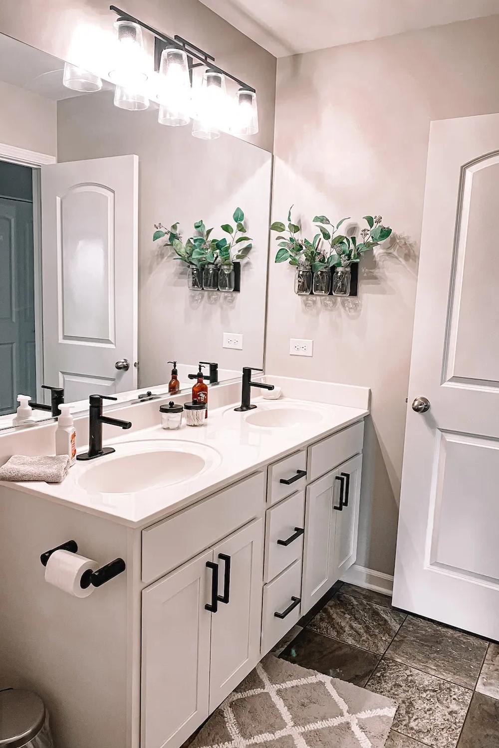 A minimalist dual sink Boho bathroom vanity featuring natural accents.