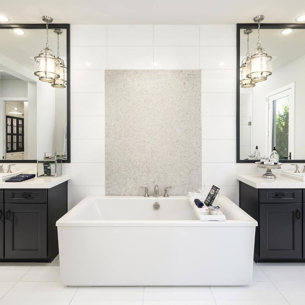 Sleek Black and White Vanity featuring a freestanding bathtub and chic design.