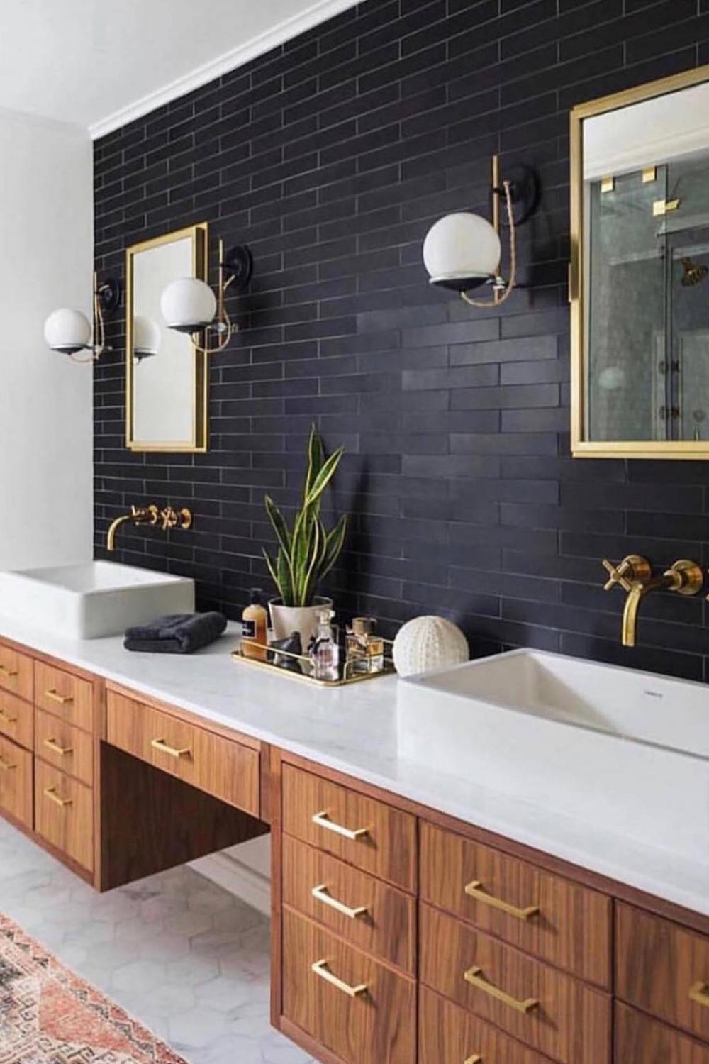 Luxurious blue double vanity with unique wall art and elegant fixtures