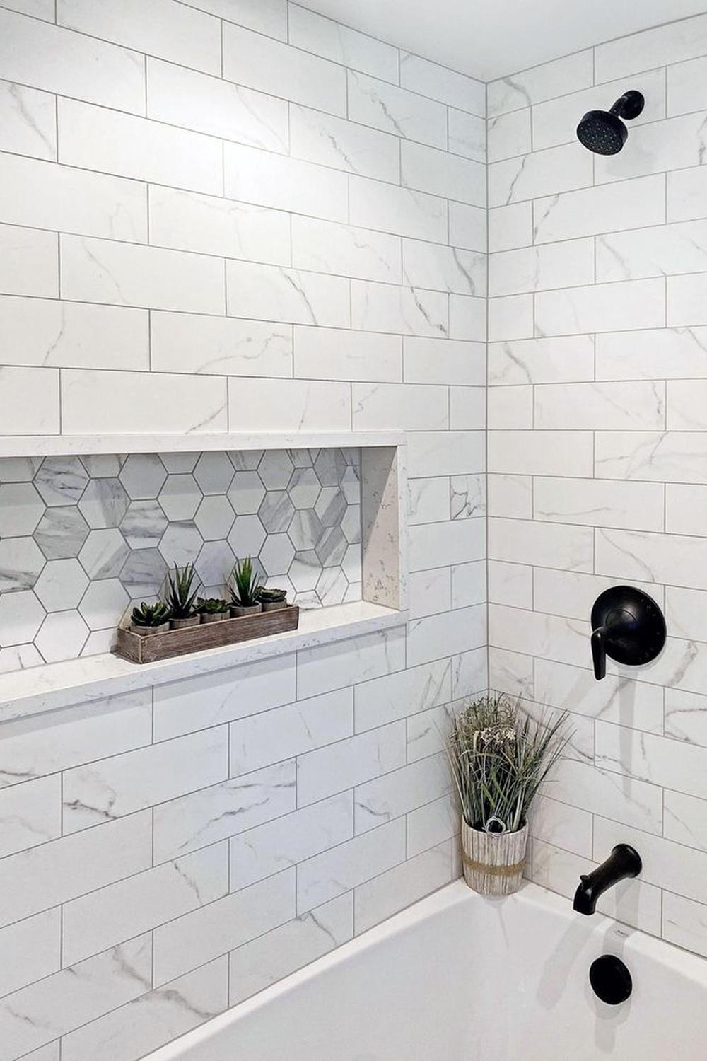 Elegant white marble effect shower tiles that create a luxurious feel for modern bathrooms.