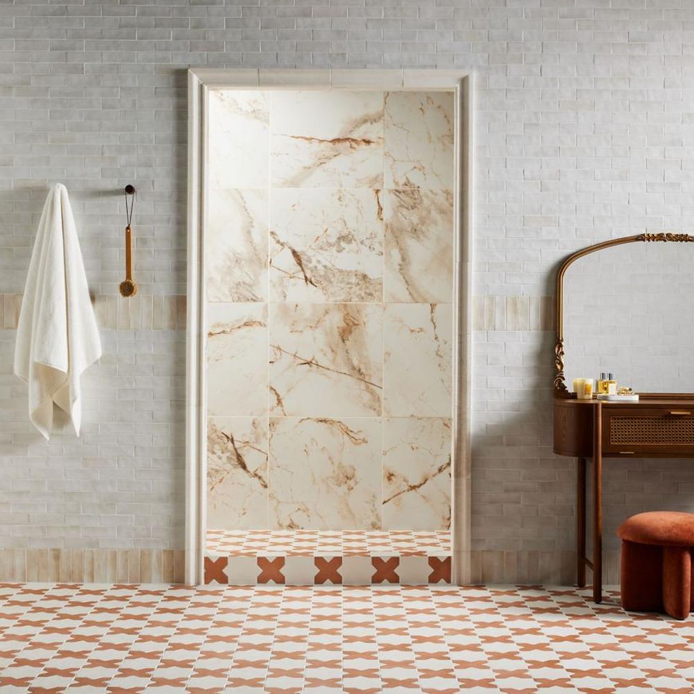Luxurious light marble tiles being complemented by textured surroundings.