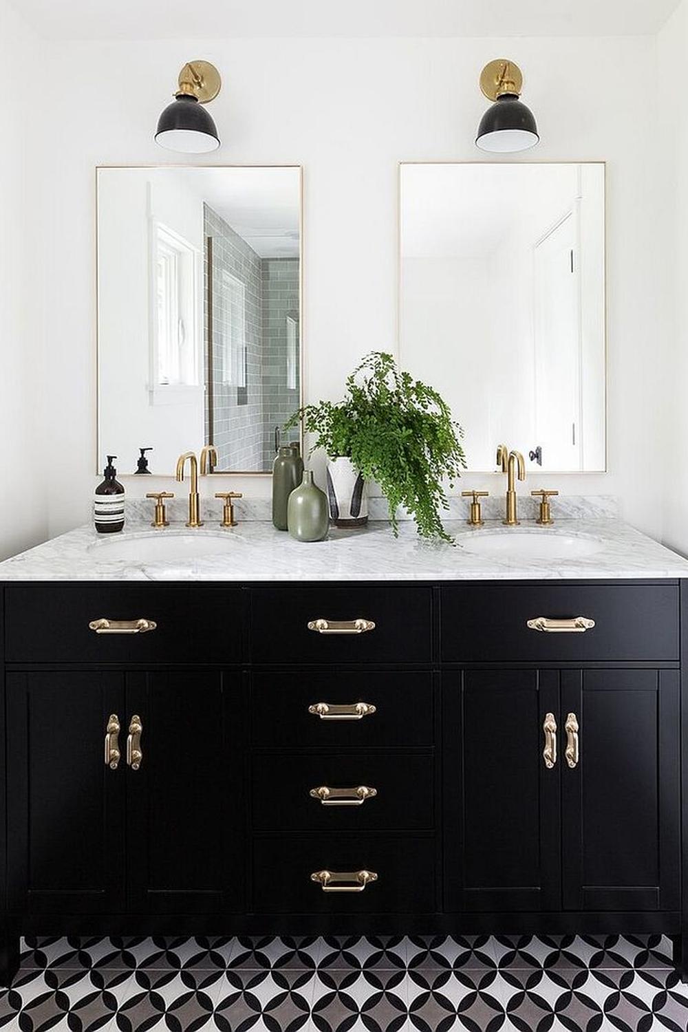 Stylish American farmhouse bathroom featuring black cabinetry and eye-catching decor elements.