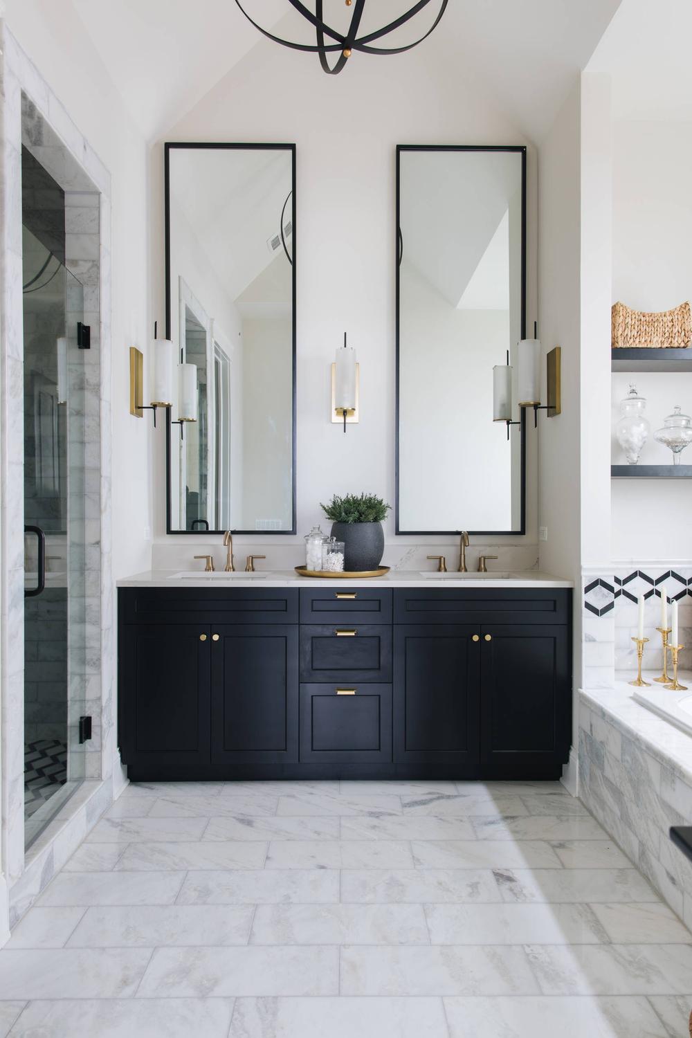 Charming American farmhouse bathroom featuring striking black accents with warm wood tones.
