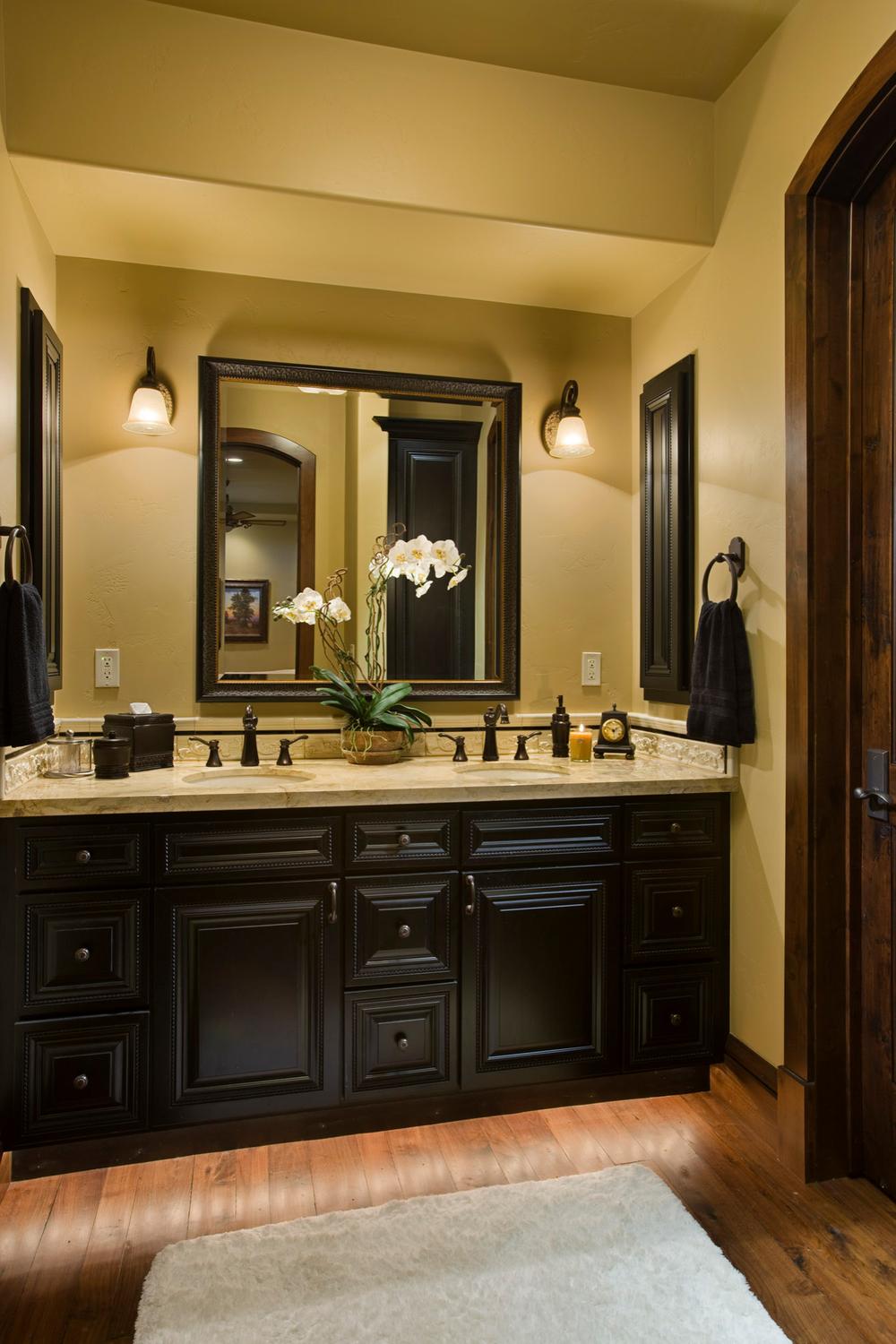 Whimsical American farmhouse bathroom featuring vintage character and black accents.