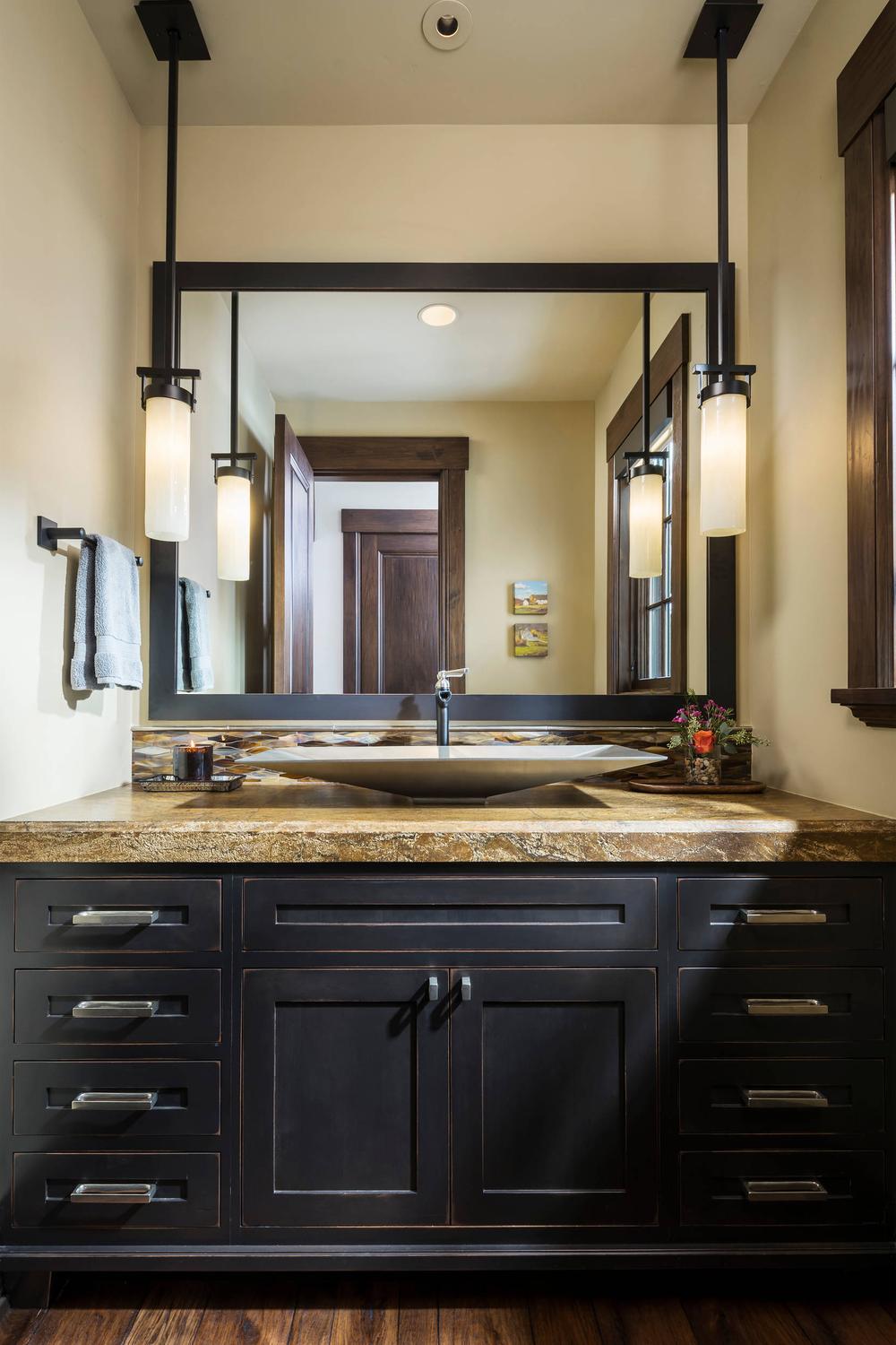 Elegant American farmhouse bathroom designed for relaxation with soaking tub and elegant details.