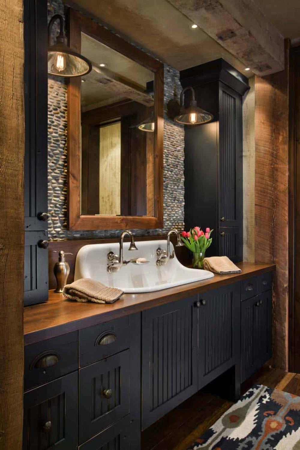 Harmonious American farmhouse bathroom showcasing modern rustic charm with black cabinetry.