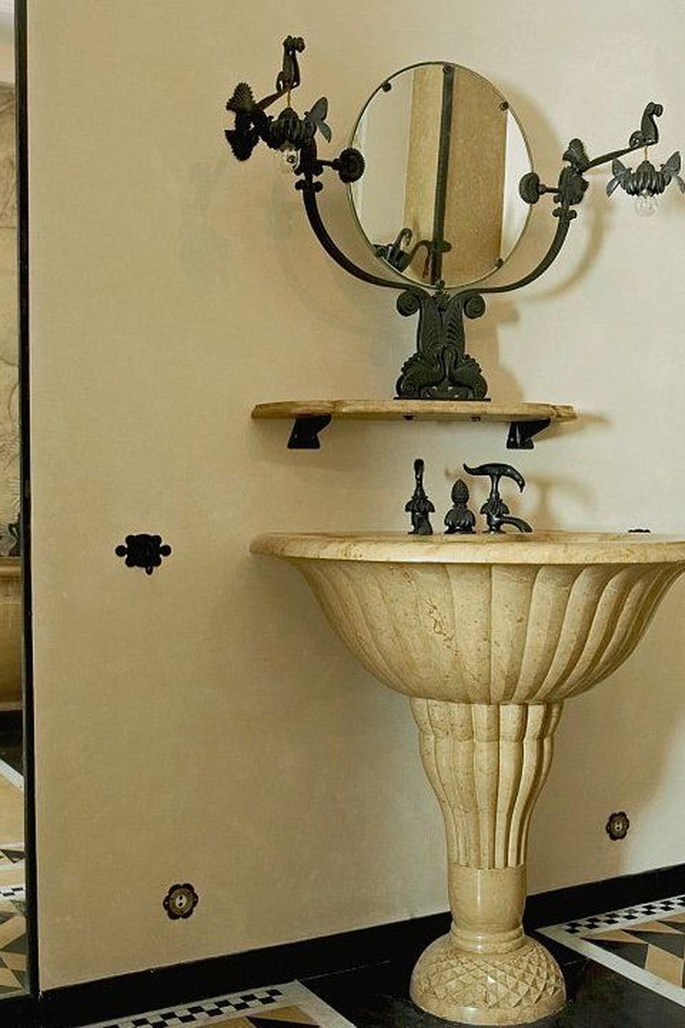Art Deco bathroom with sculptural sink featuring fluted design and elegant styling