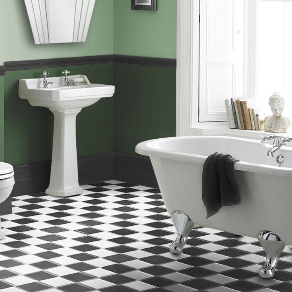 Art Deco bathroom with two-tone green walls and classic clawfoot bathtub