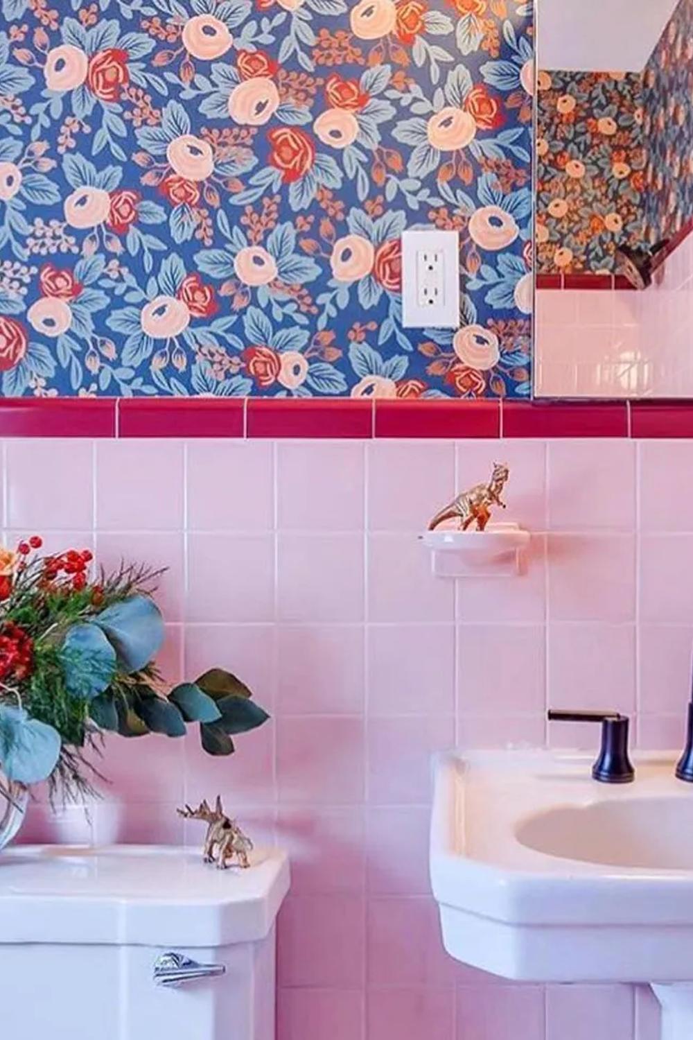 Art Deco bathroom featuring vintage floral wallpaper and pink tiles.