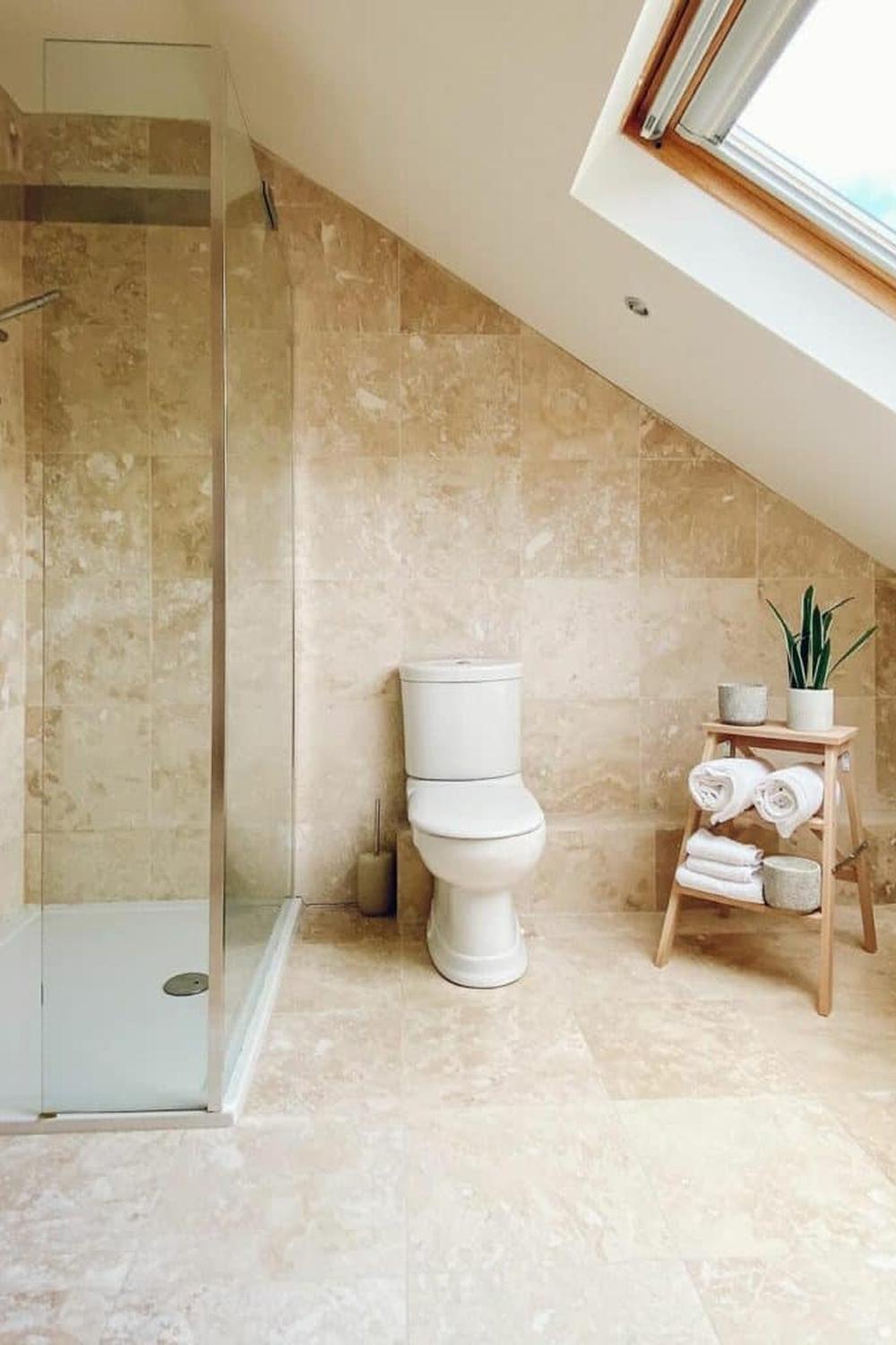 Elegant attic bathroom featuring smart design choices for space utilization