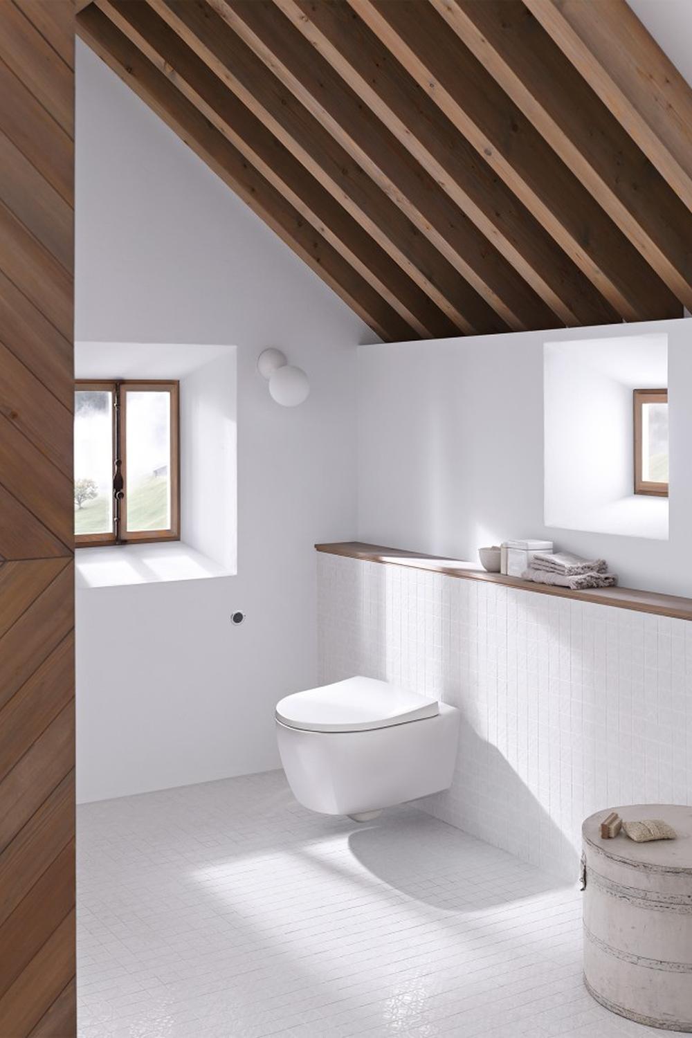 Minimalist attic bathroom showcasing cozy and comfort elements