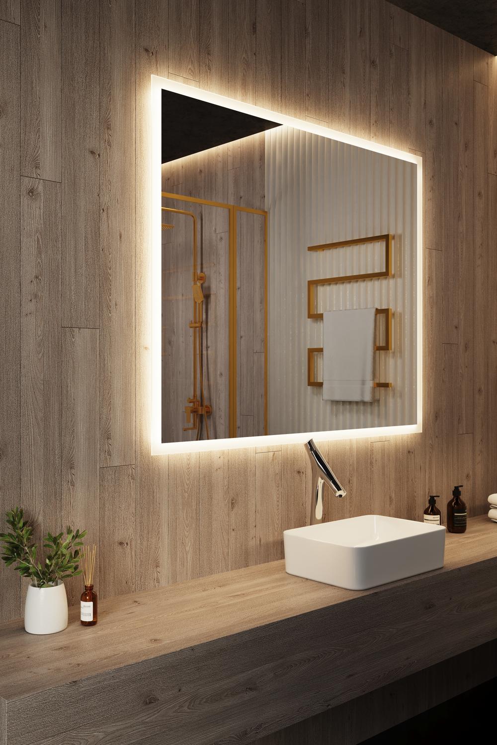 Large backlit mirror above a light wooden vanity in a cozy bathroom with warm tones