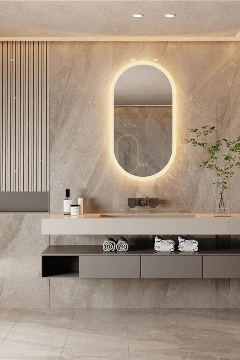Minimalistic design of a floating vanity with a backlit mirror in a contemporary bathroom