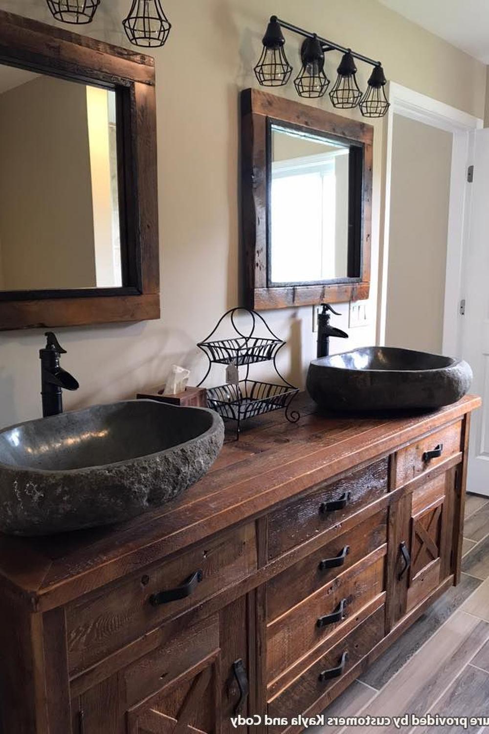 Bright barn bathroom showcasing a wooden vanity and natural vessel sinks.