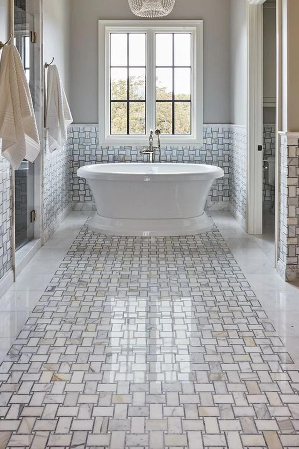 Bathroom showcasing a minimalist design strategy around basketweave tiles for an organization.