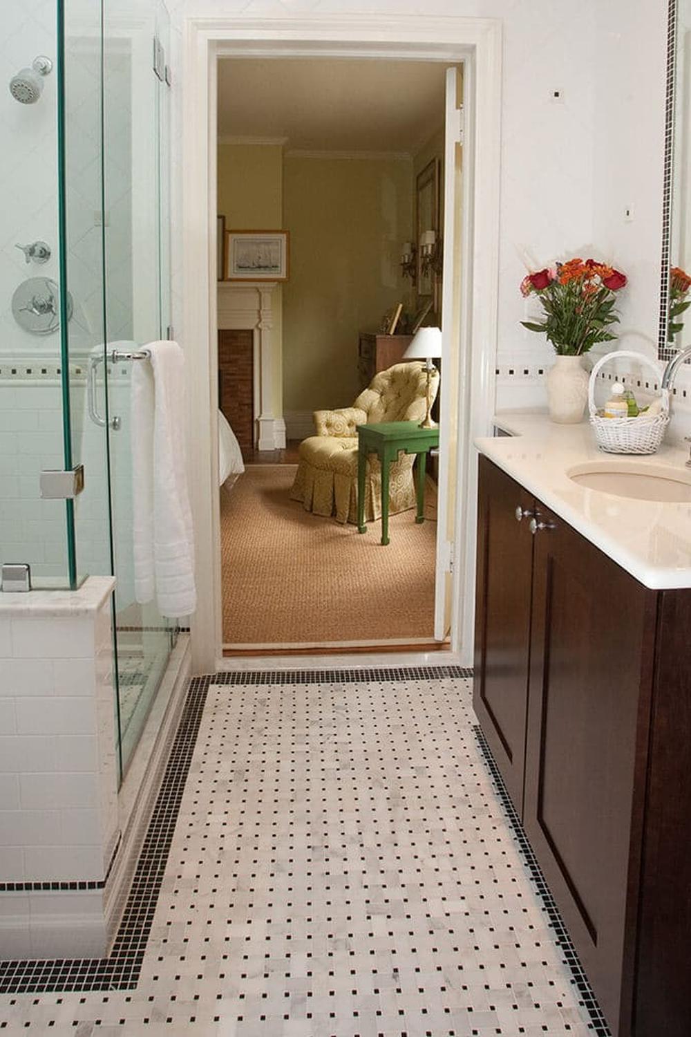 Bathroom with stylish mirrors reflecting the beauty of basketweave tile.