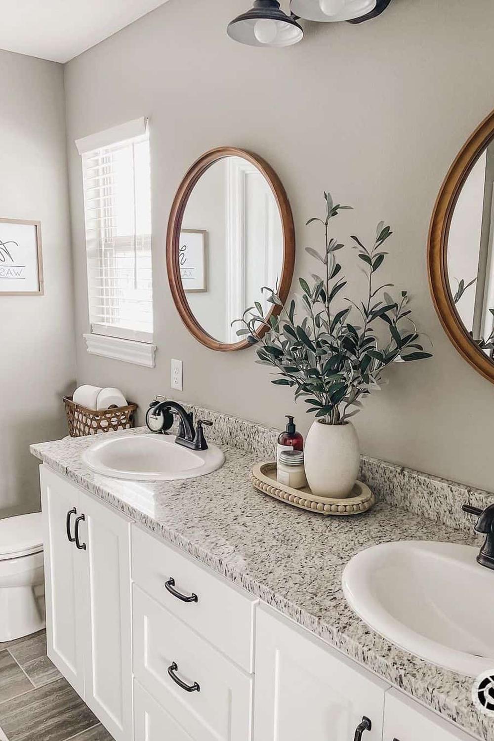 Stylish bathroom counter with speckled granite and decorative elements.