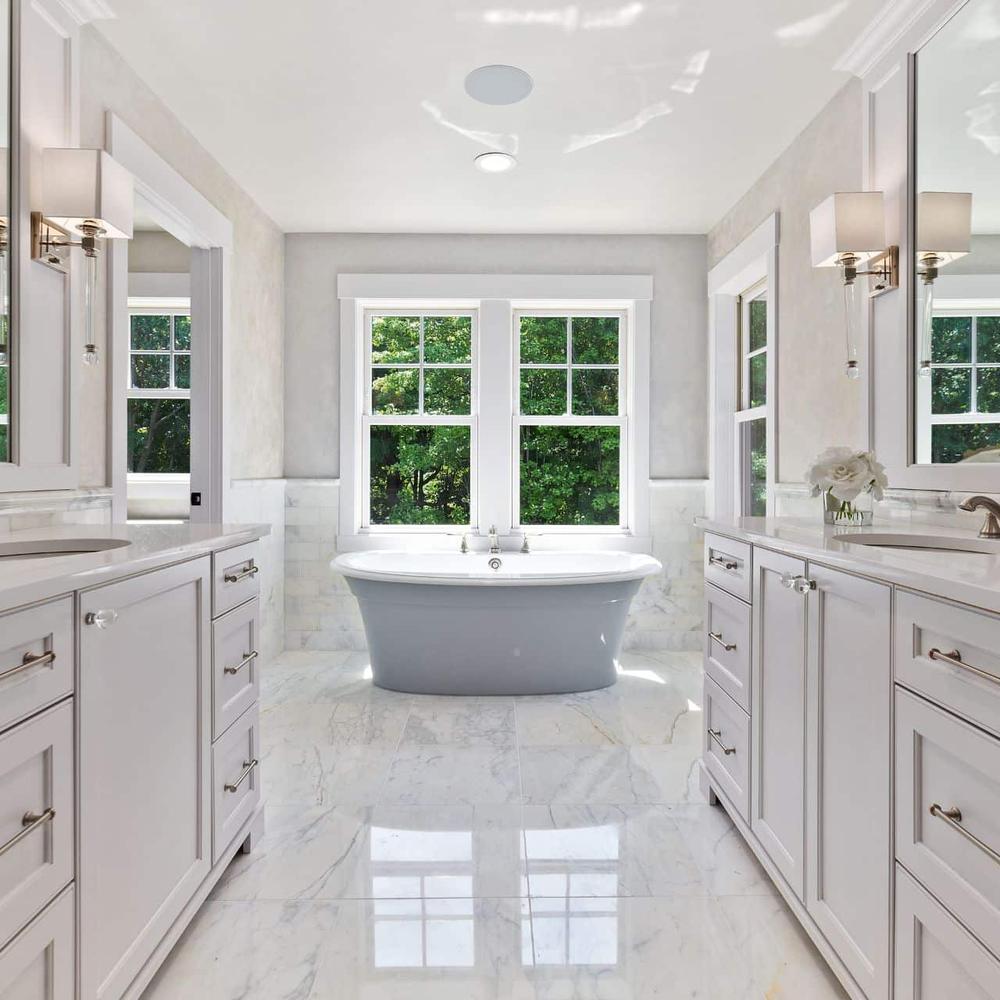 Elegant bathroom showcasing luxurious marble tiles with subtle veining
