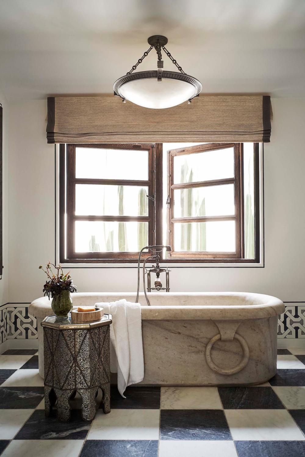 Beautiful bathroom with classic black-and-white checkered tiles providing a timeless style