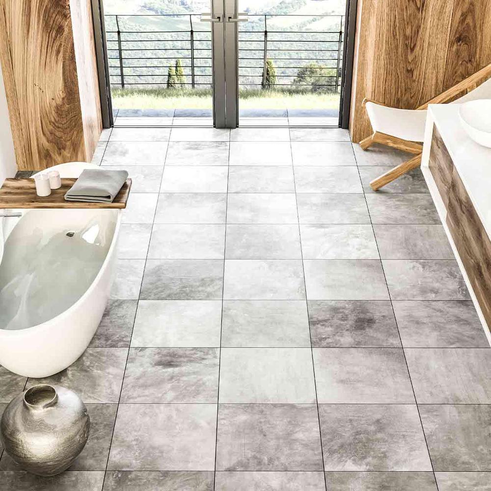 Sleek bathroom showcasing large-scale gray tiles and minimalist design