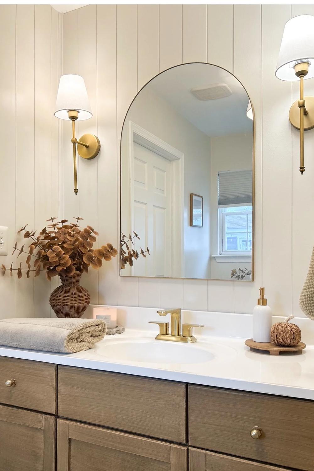 Modern bathroom featuring stylish elements and natural touches.