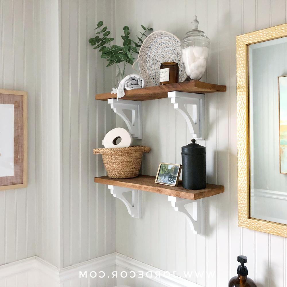 Stylish shelves in a light green bathroom
