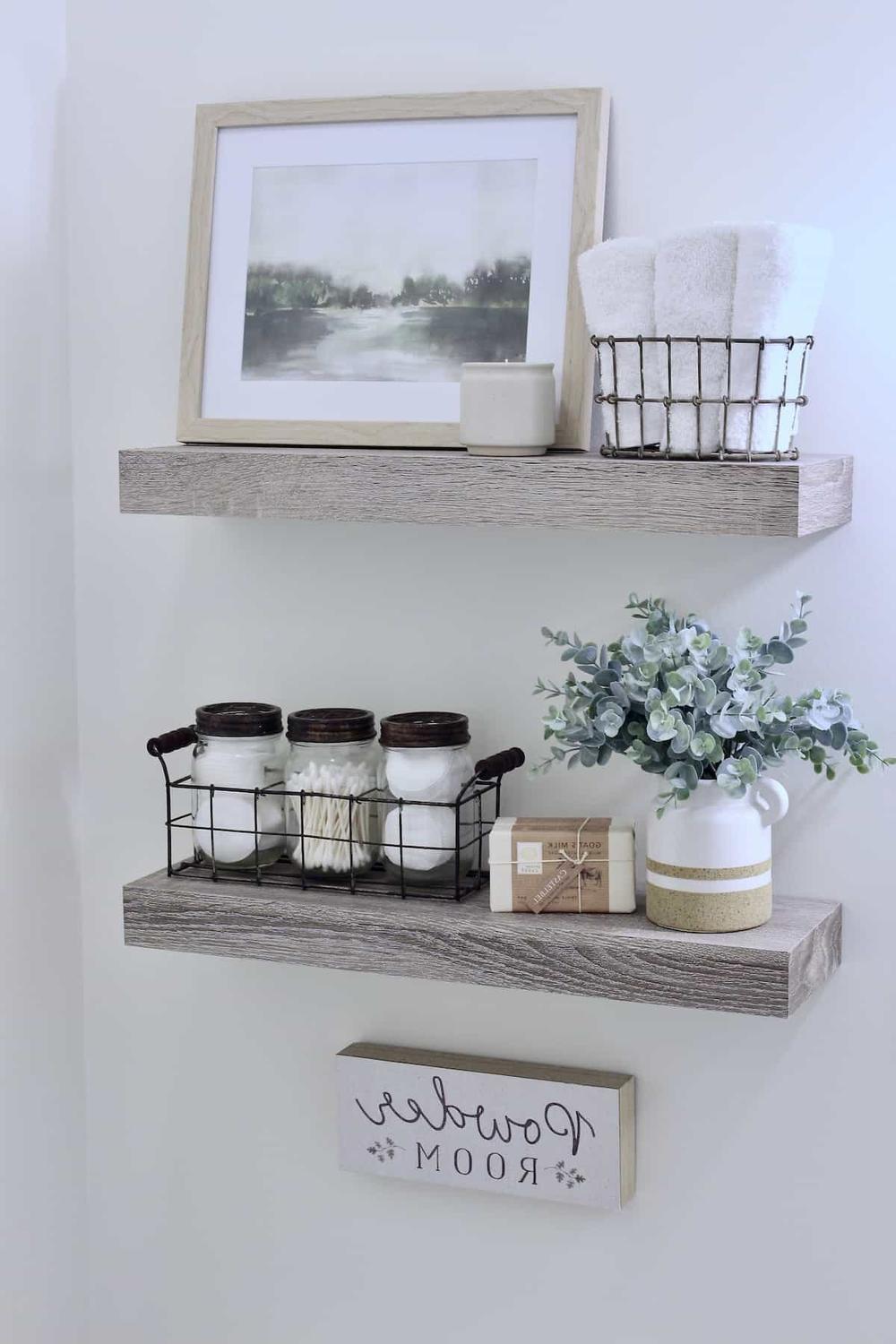 Well-decorated bathroom shelf with personal touches and decor