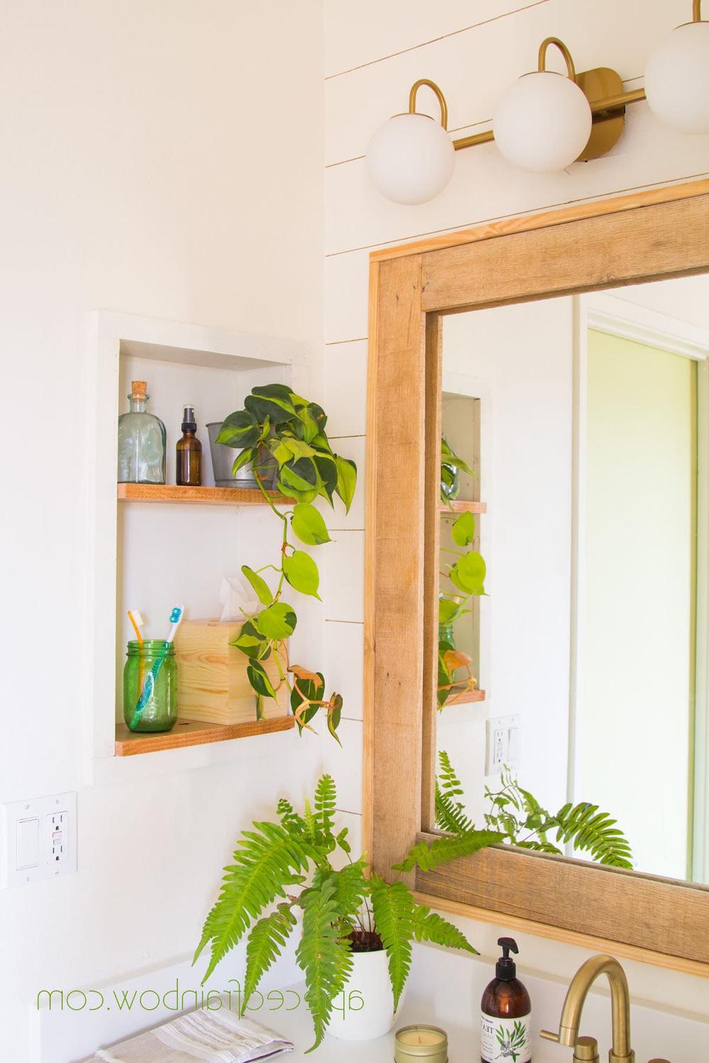 Personalized bathroom decor showcasing glass jars and plants