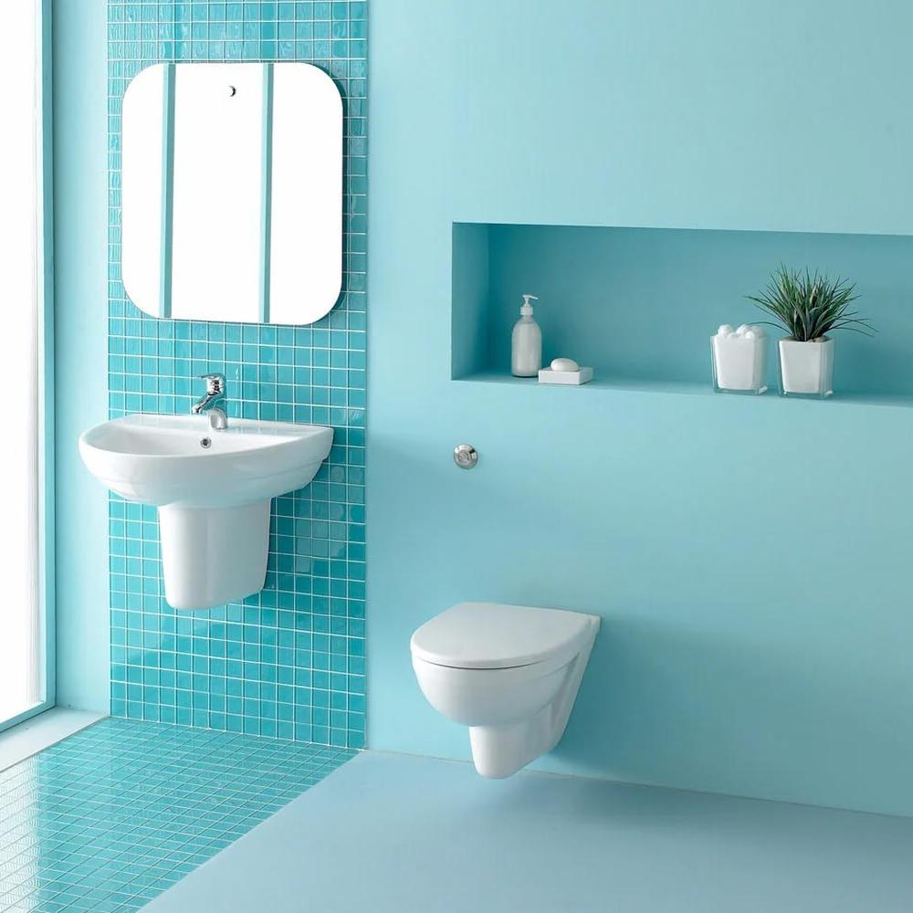 An inviting turquoise bathroom designed with wall-mounted accents and modern fixtures, providing a refreshing look.