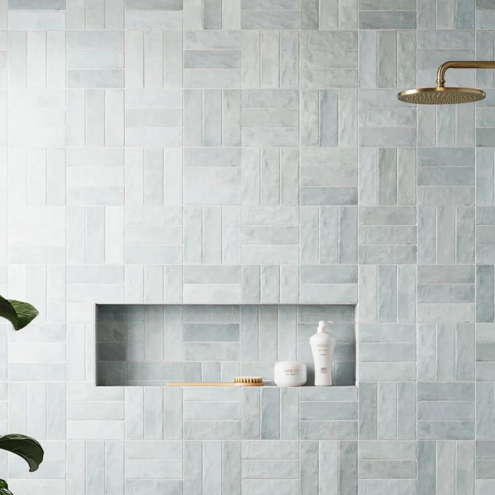 A delightful bathroom featuring soft pastel tiles and modern fixtures, creating a joyful and refreshing atmosphere.