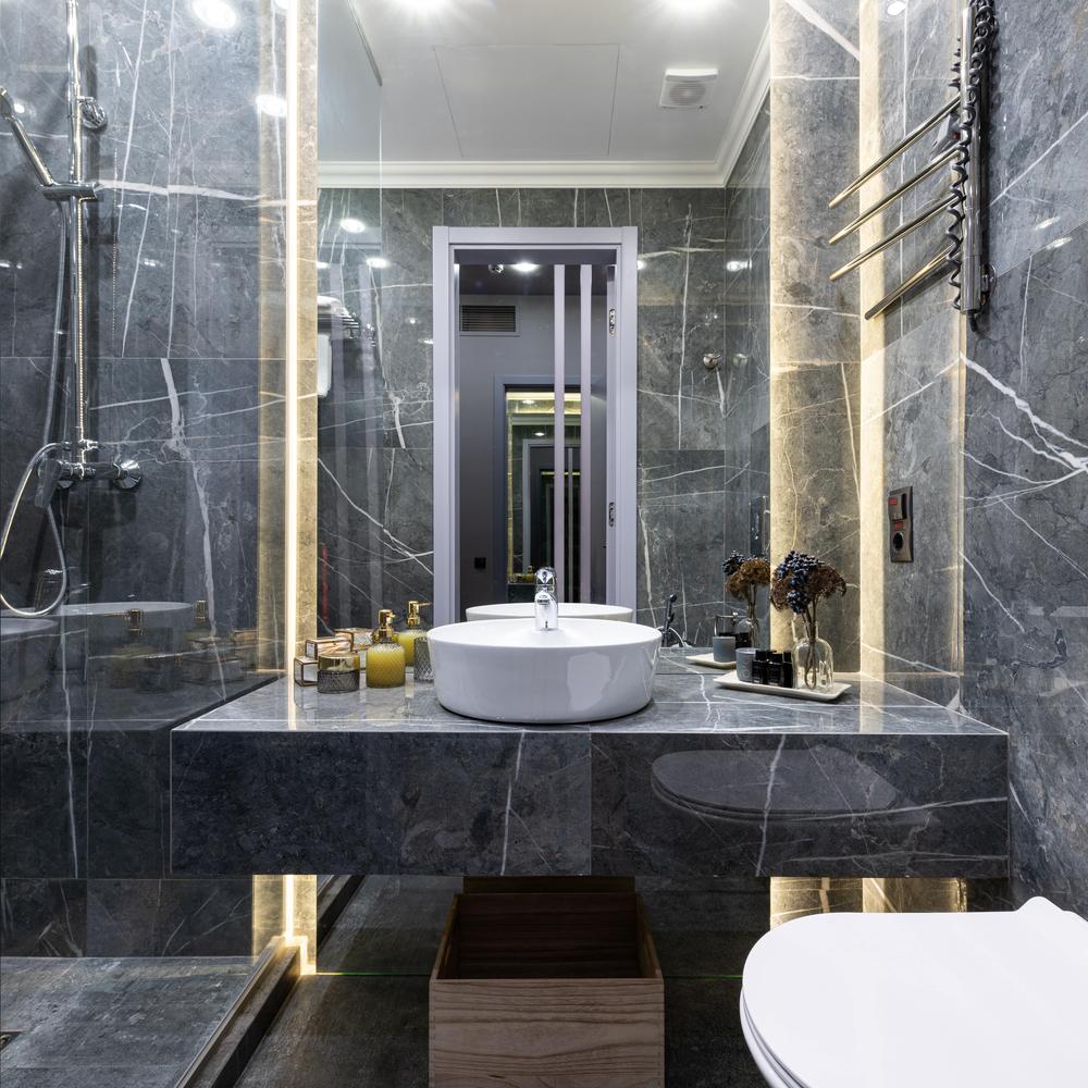 Modern bathroom featuring sleek gray marble with elegant features
