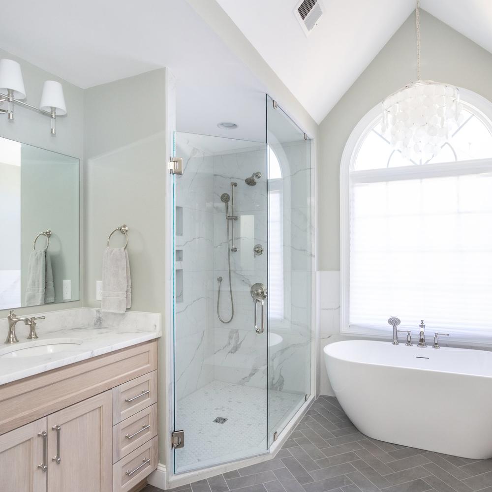 Stylish bathroom design featuring white marble and elegant fixtures