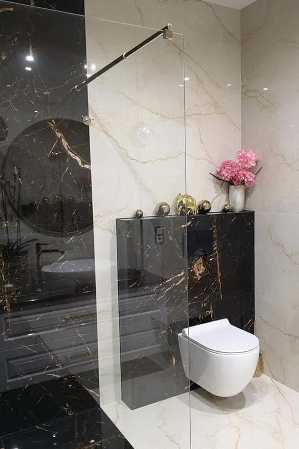 Modern bathroom with striking tile contrasts and elegant fixtures