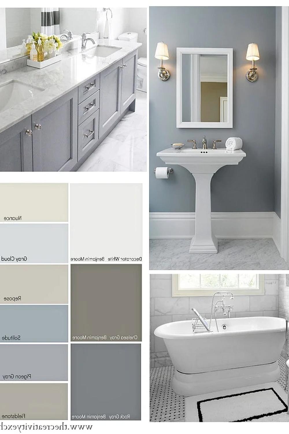 Soft gray bathroom vanity with a light marble countertop, complemented by elegant lighting.