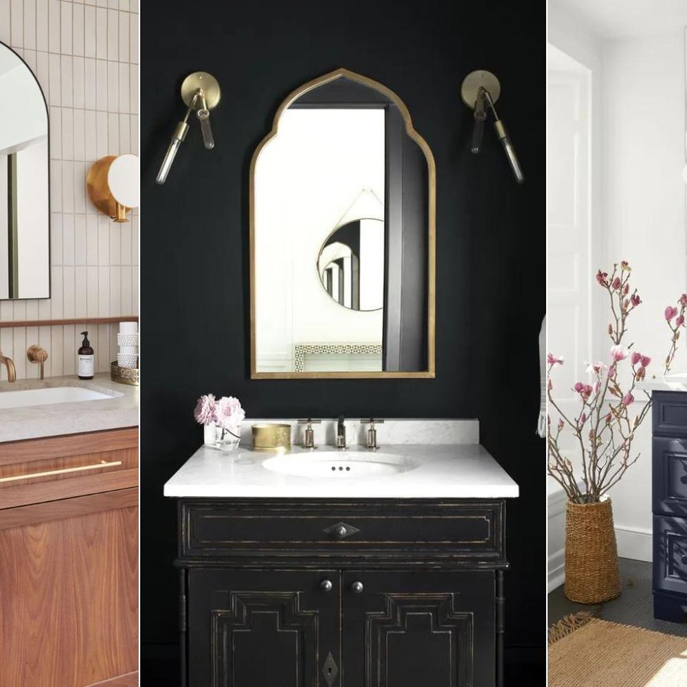 Dark navy bathroom vanity featuring intricate designs and accessorized decor.
