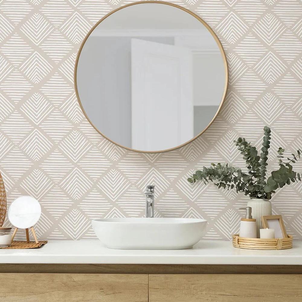 A stylish bathroom featuring soft beige geometric wallpaper with white diamond shapes that creates a contemporary look.