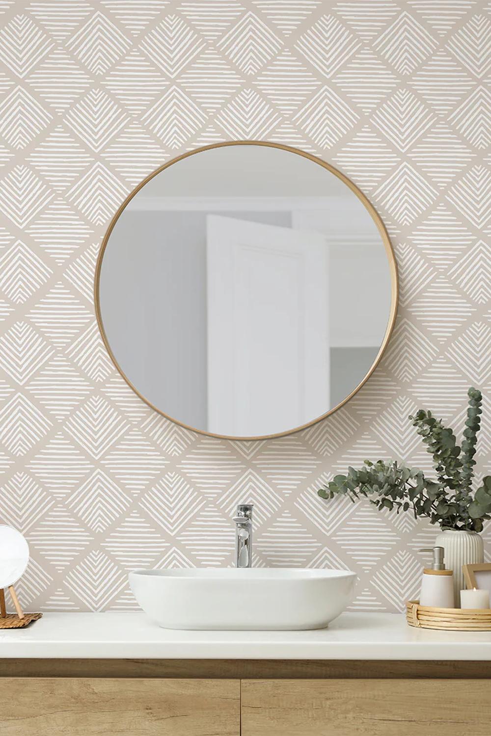 A bathroom showcasing taupe wallpaper with white diagonal lines forming a diamond shape for a modern vibe.