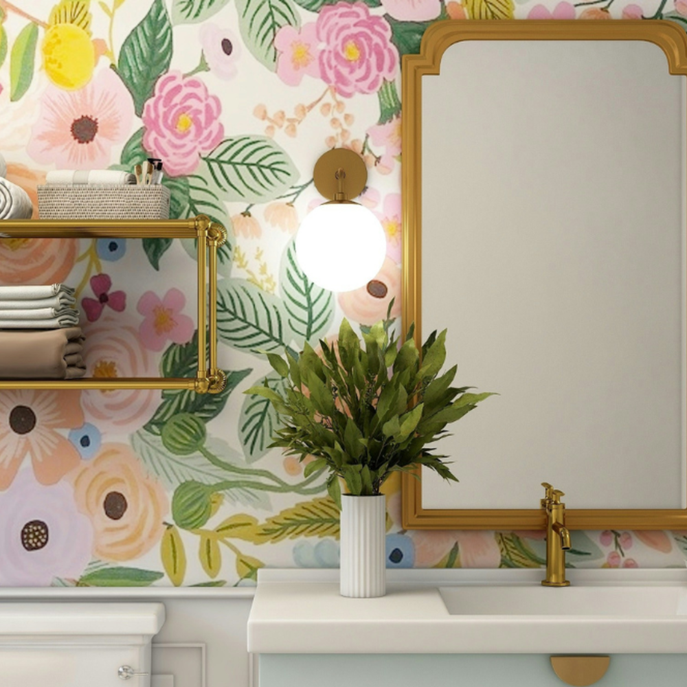 A vibrant bathroom featuring floral wallpaper in pink and yellow tones with whimsical design elements.