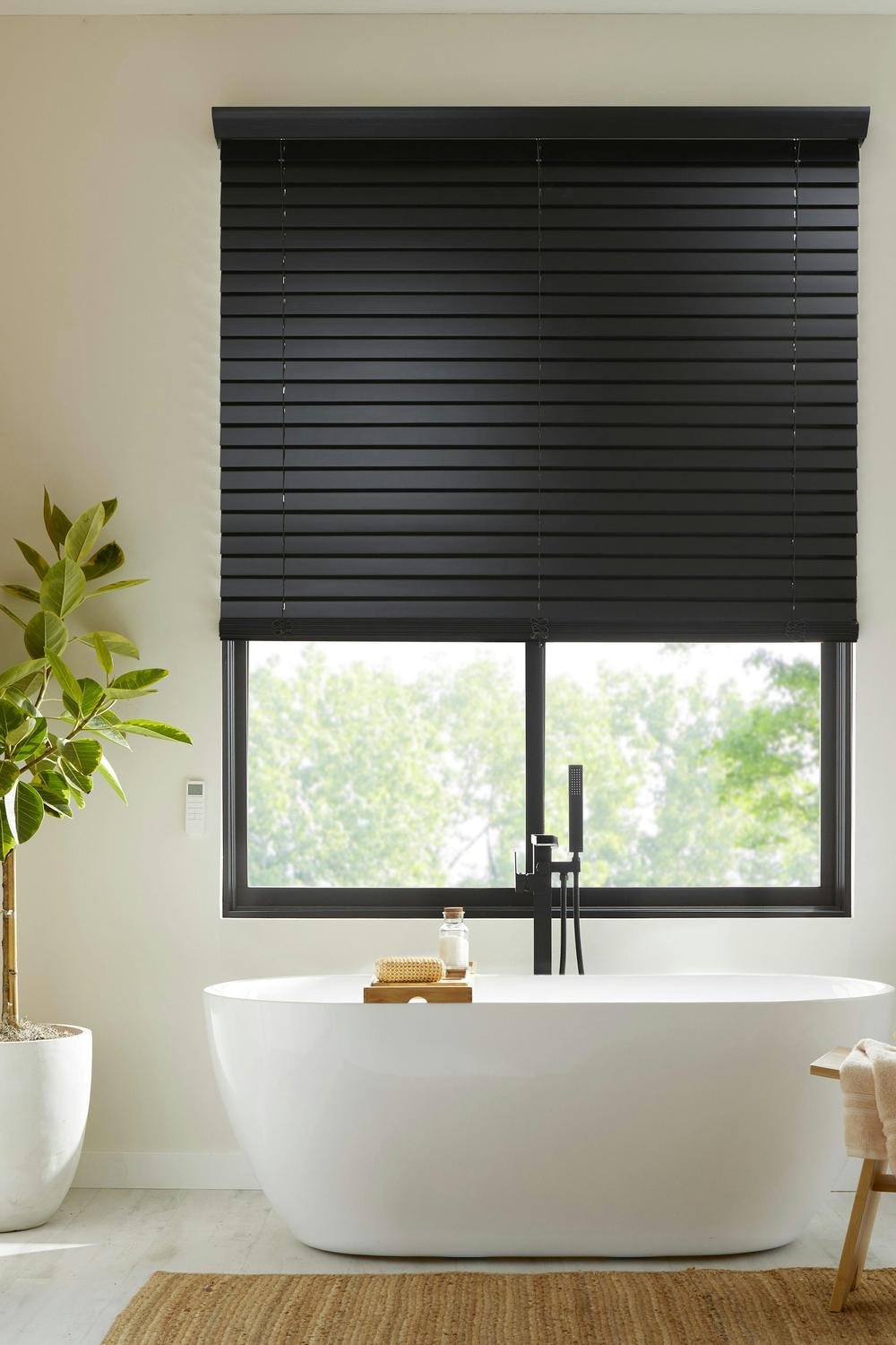 Fresh Bamboo Shades for Eco-Chic Vibes - a serene bathroom featuring bamboo window treatments.