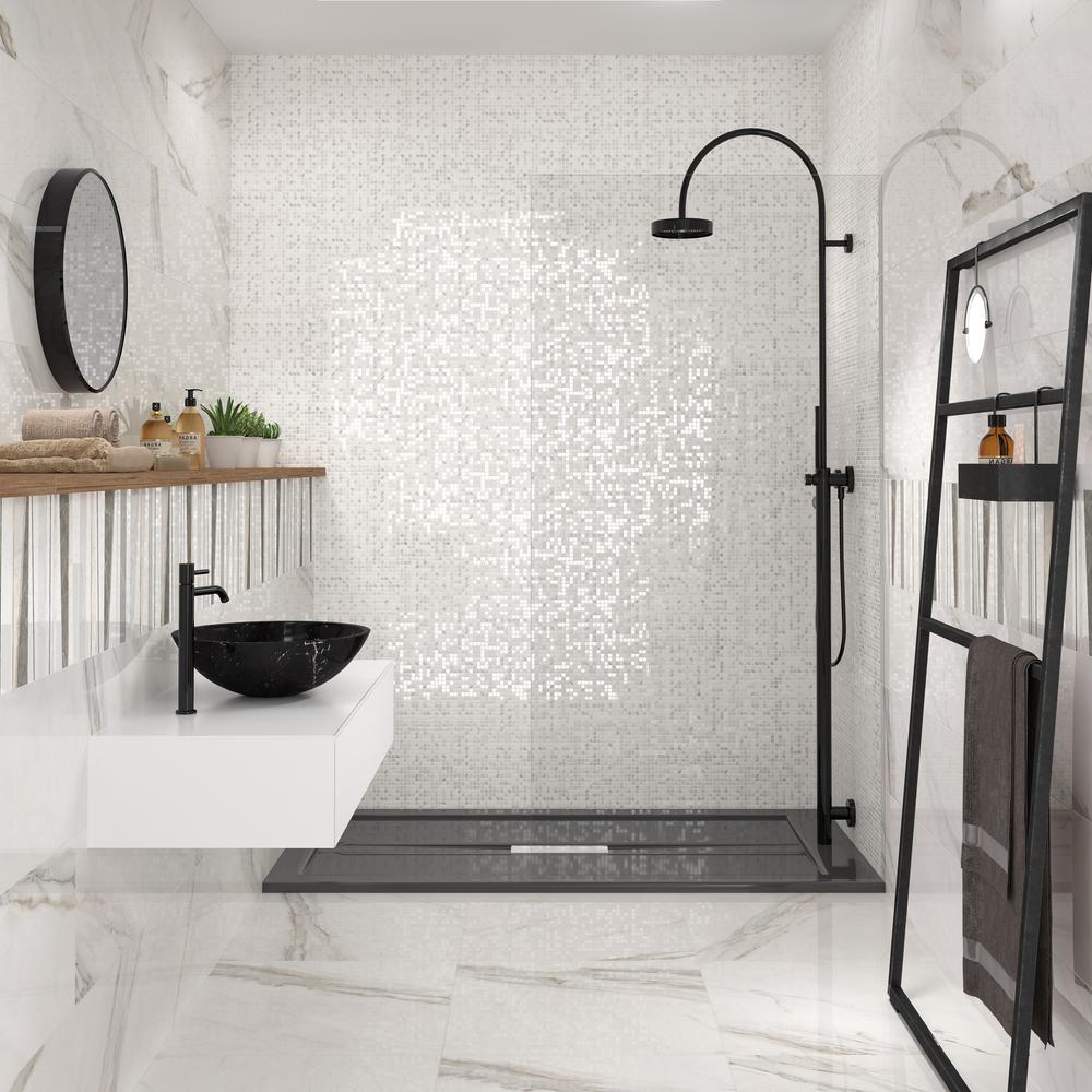 A sophisticated modern bathroom design featuring black fixtures and a floating sink.
