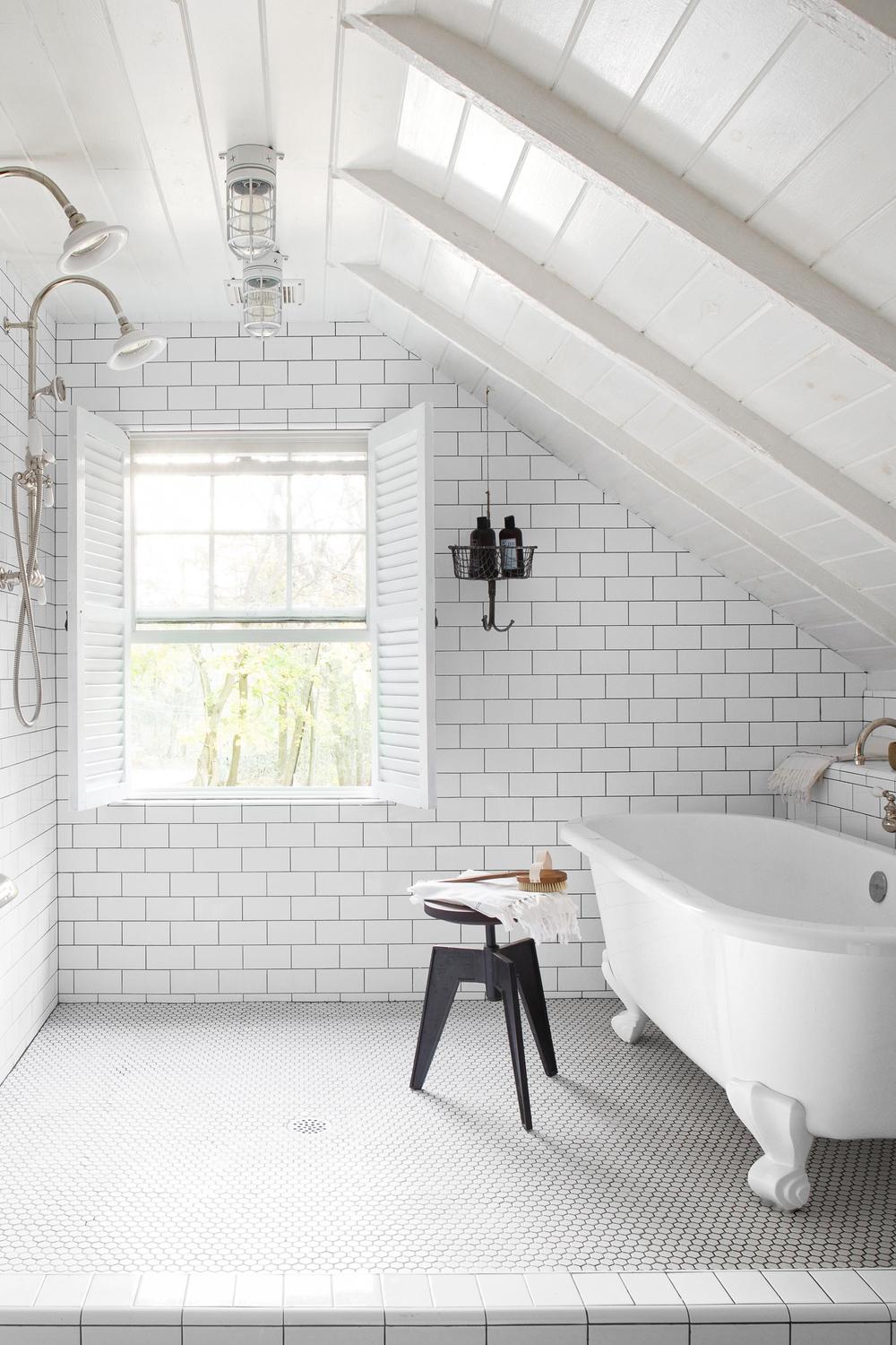 Modern chic bathroom with botanical touches and well-styled accessories.