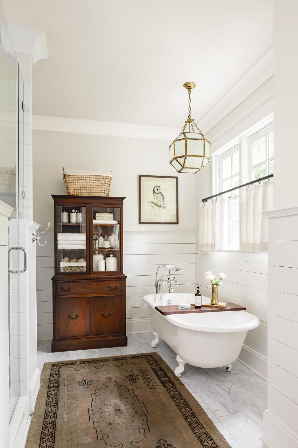 Spa-like bathroom design featuring elegant accents and cozy details.