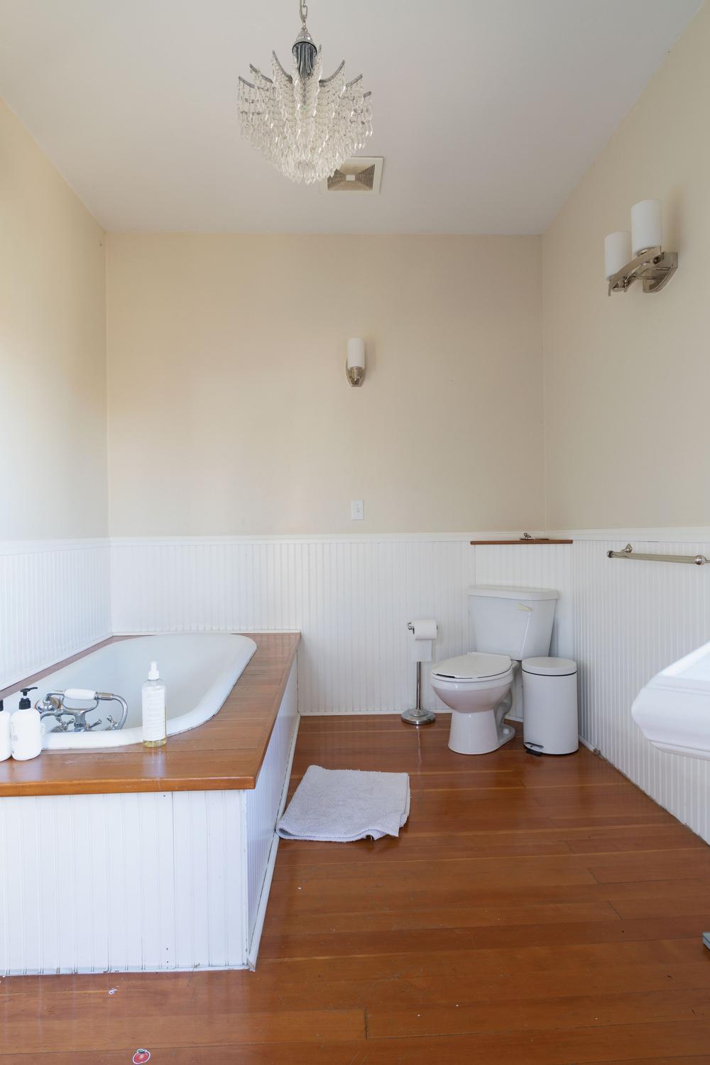 Elegant bathroom featuring a clawfoot tub and seamless contemporary fixtures.