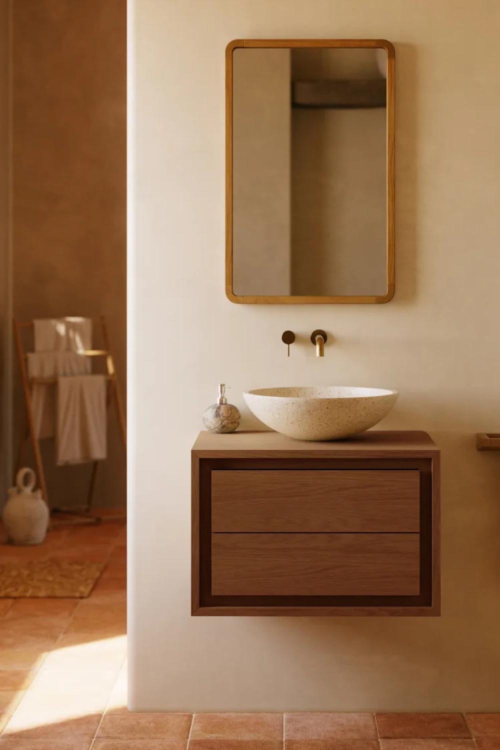 Baño minimalista con elementos cálidos y modernas texturas
