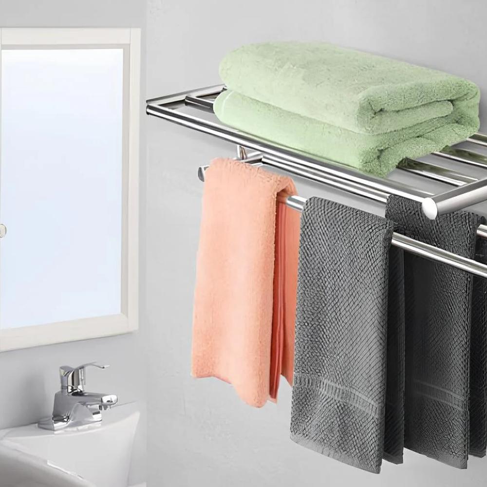 Sleek chrome towel rack displaying gradient colored towels against a soft gray backdrop in a modern bathroom