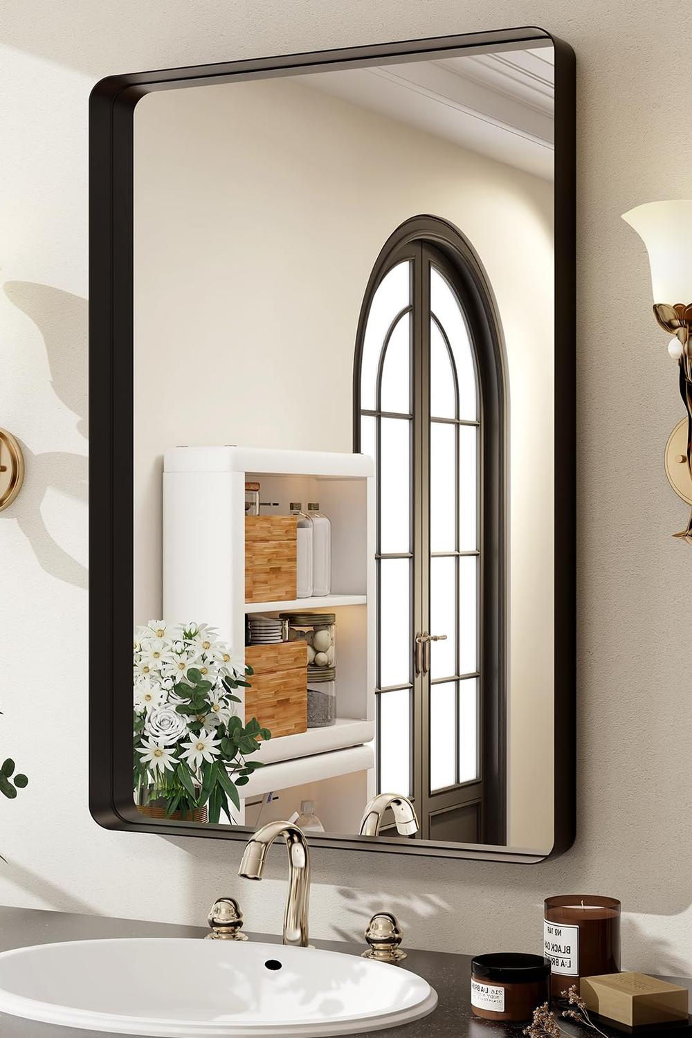 Sleek rectangular black bathroom mirror in a modern setting with light-filled ambiance.
