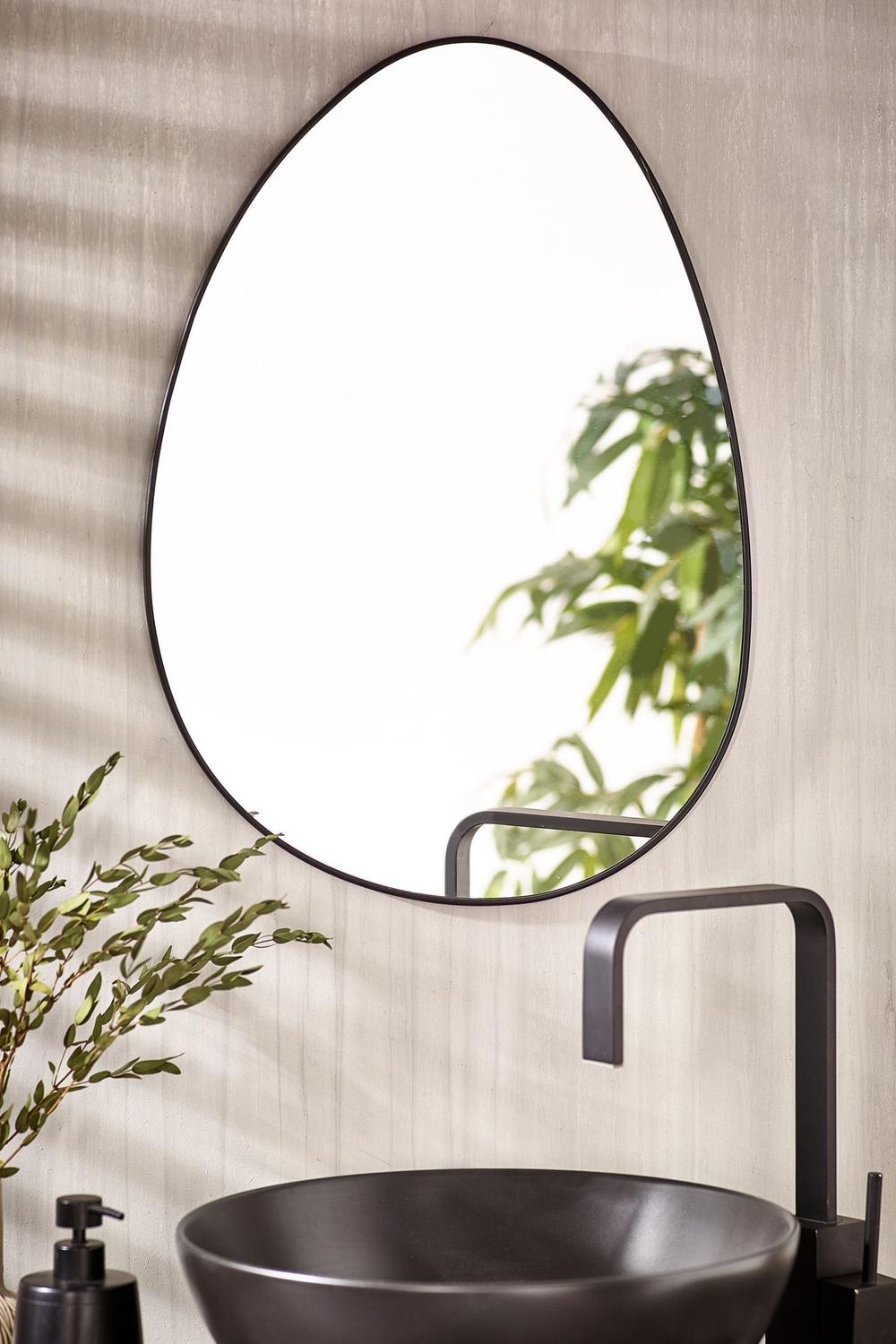 Contemporary bathroom showcasing a cozy black mirror with lighted accents.