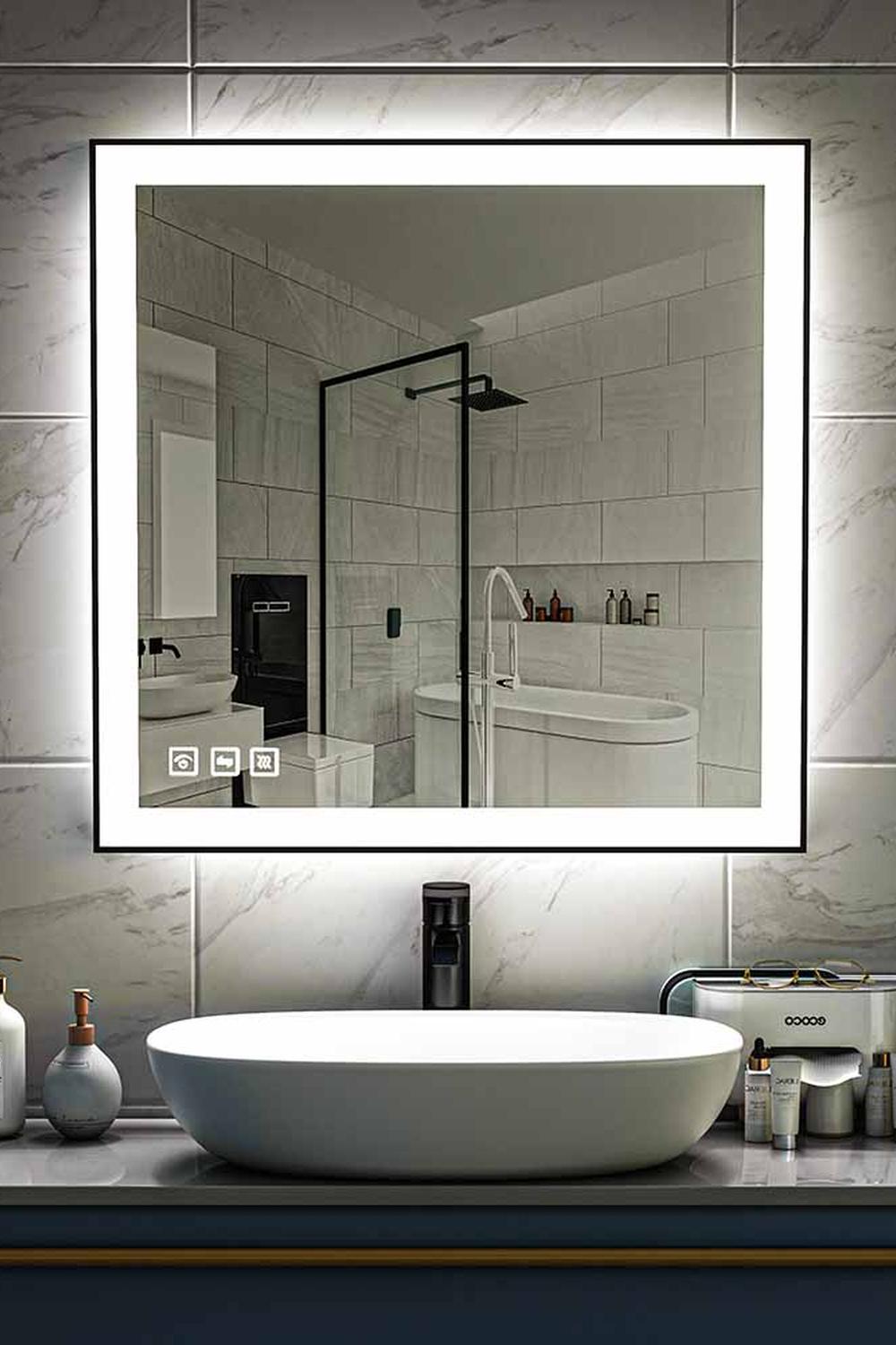 Modern black bathroom mirror with integrated LED lighting accents.
