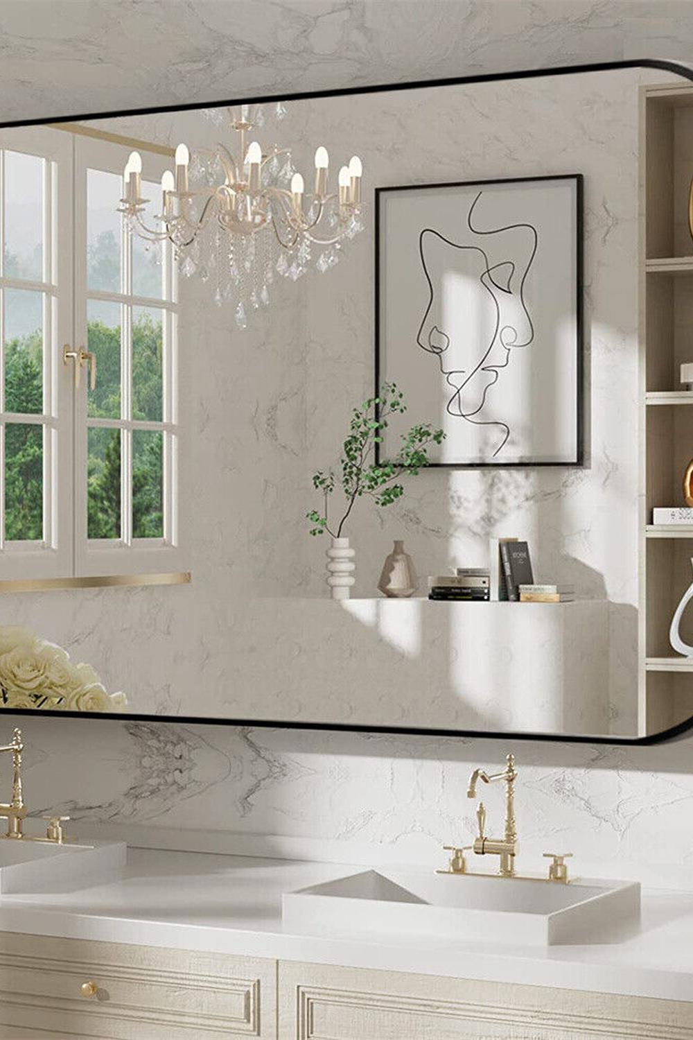 Statement black bathroom mirror providing a lively glow in a modern setting.