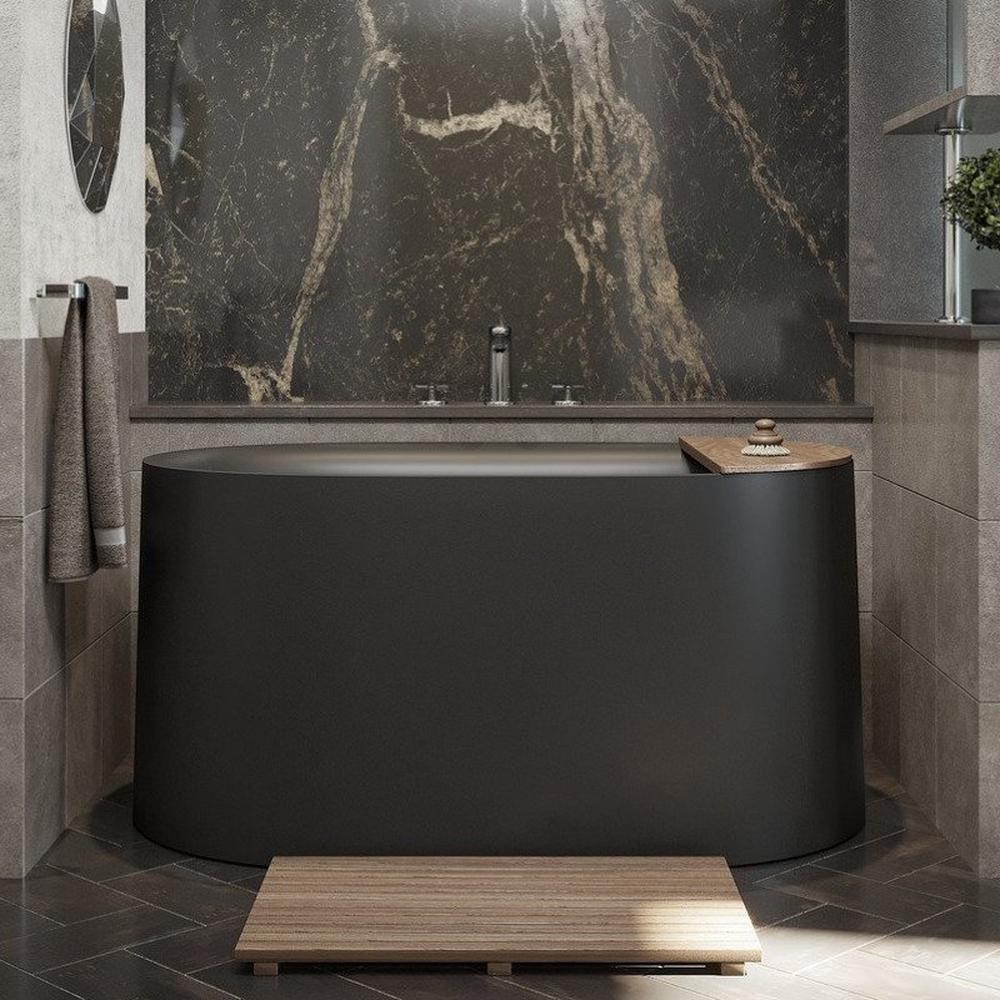 Modern bathroom featuring a sleek black bathtub, a dramatic dark marble wall, and stylish lighting elements.